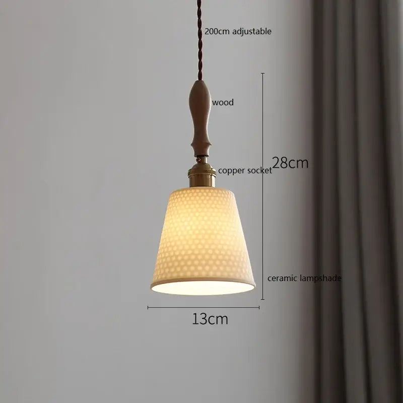 Warm-toned butterfly ceramic led pendant lamp with honeycomb texture hanging from wooden handle and copper socket