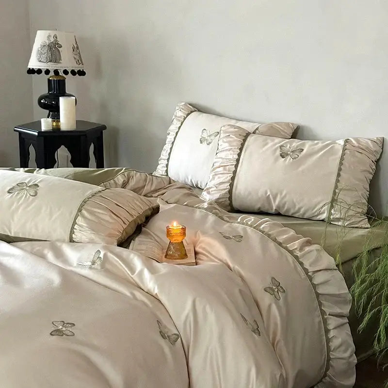 Cream satin bedding set with decorbites butterfly embroidery and ruffled edges for elegant bedroom decorbites butterfly design