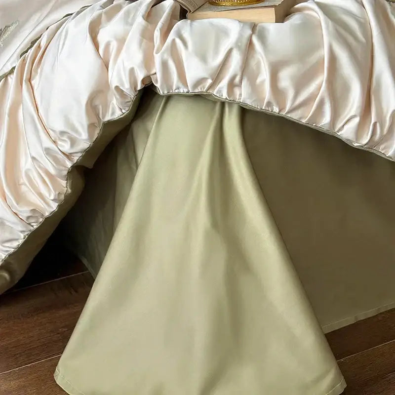 Cream-colored satin bed skirt with gloss finish and subtle ruching in decorbites butterfly embroidery bedding set