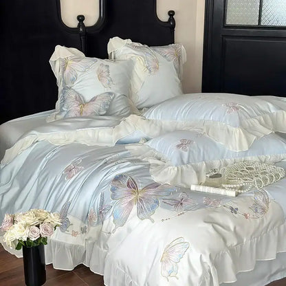 Light blue cotton bedding set with delicate decorbites butterfly embroidery and soft lace ruffles for elegant bedroom decor