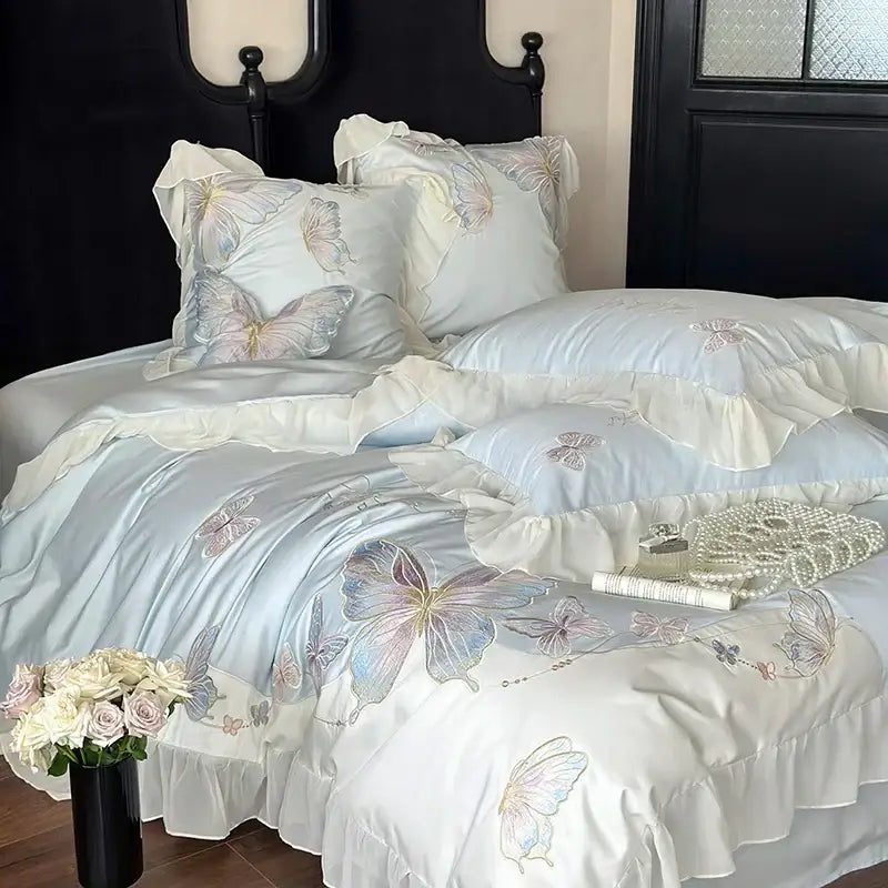 Light blue cotton bedding set with decorbites butterfly embroidery and soft lace ruffles for elegant bedroom decor