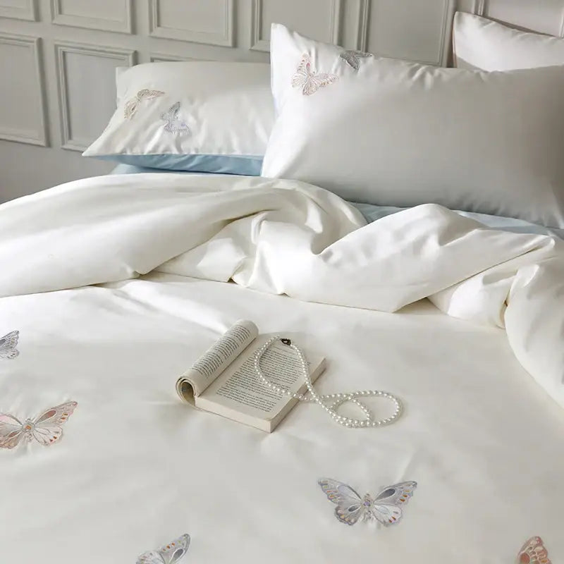 White lyocell cotton bedding set with soft pastel decorbites butterfly embroidery on satin duvet cover