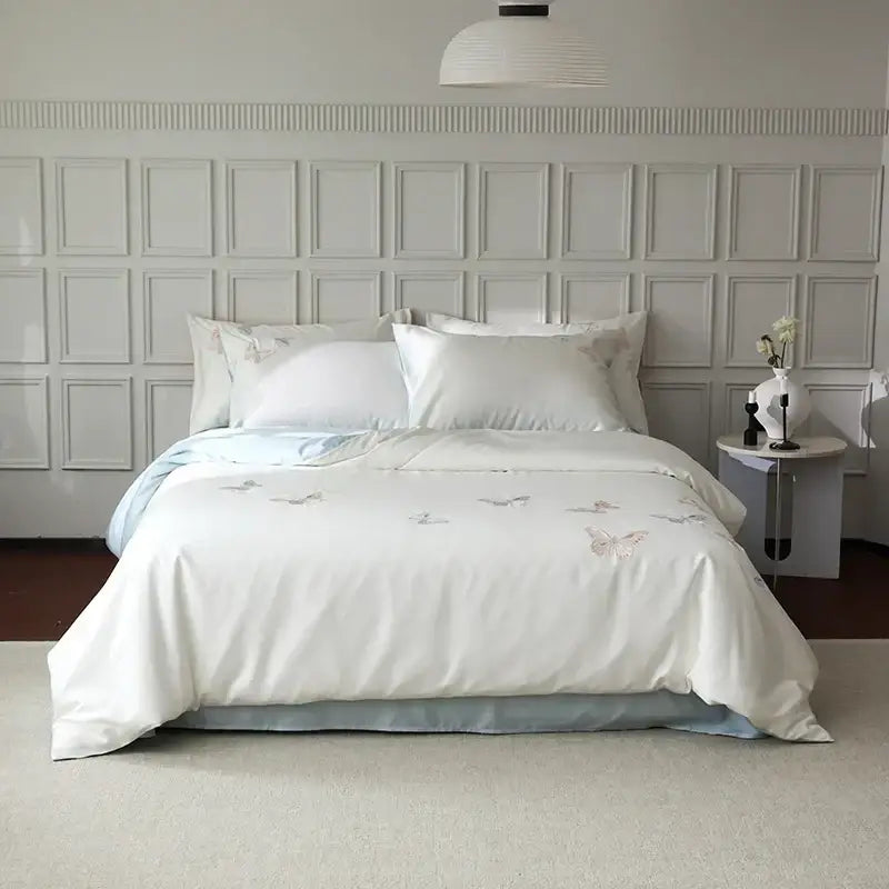 White satin lyocell cotton bedding set with soft pastel decorbites butterfly embroidery and light blue inner lining