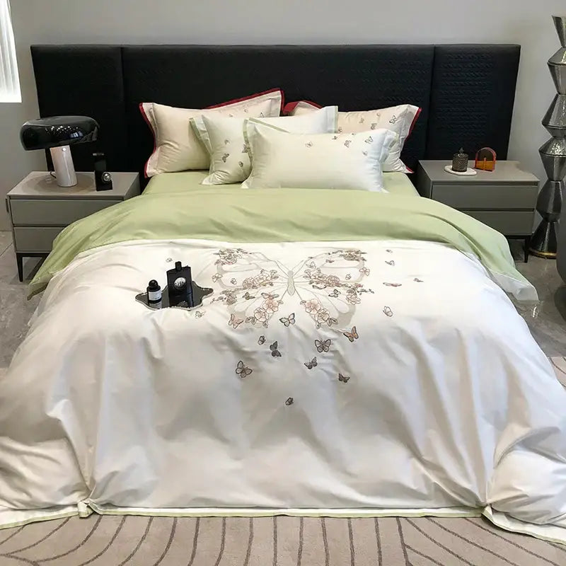 White satin duvet cover with butterfly flowers embroidery in soft pink and gray tones from decorbites bedding set