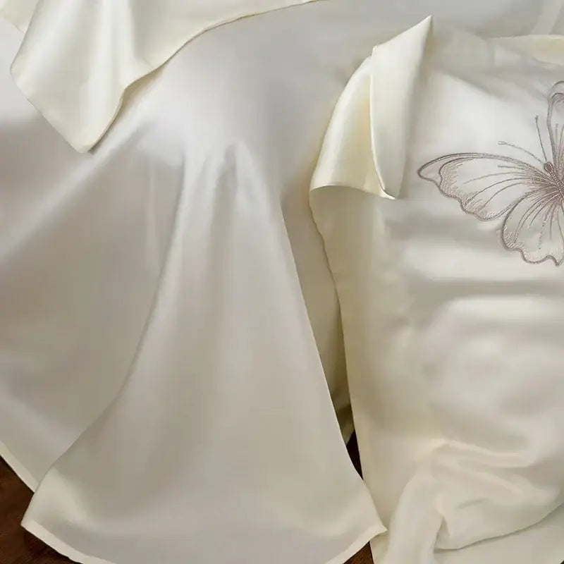 Cream-colored satin pillowcase with butterfly flowers embroidery from decorbites butterfly flowers bedding set