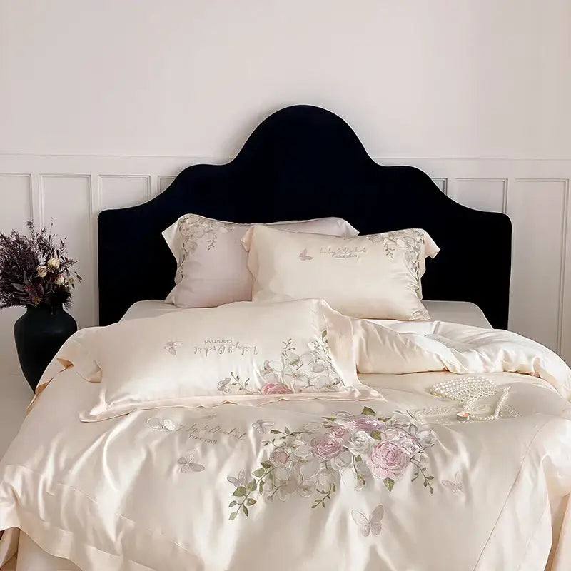 Cream-colored satin bedding set featuring delicate pink roses and butterflies with decorbites butterfly flowers embroidery