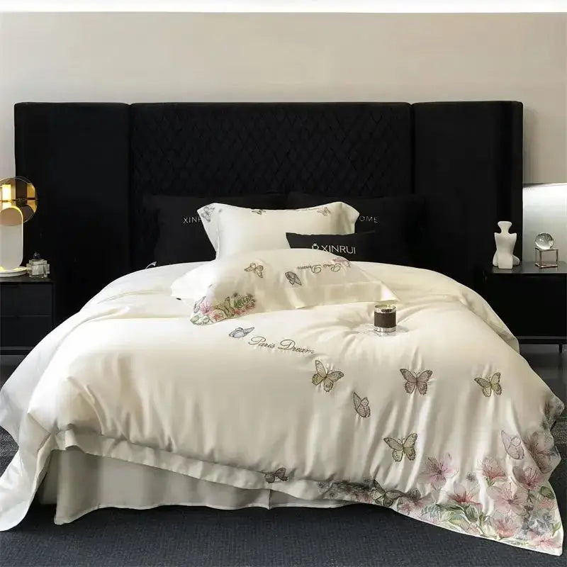Cream satin bedding set with decorbites butterfly flowers embroidery and ruffled hem for elegant bedroom decor