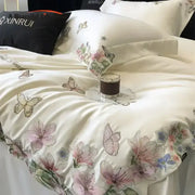 Cream satin bedding set with decorbites butterfly flowers embroidery in pink purple and green floral motifs