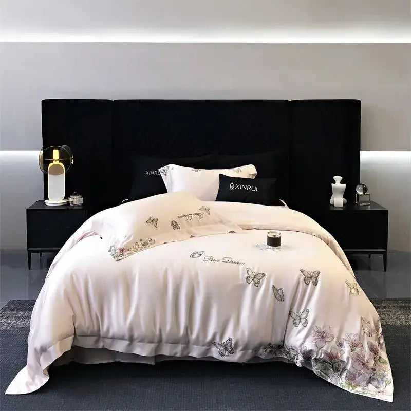 Elegant ivory satin bedding set featuring decorbites butterfly flowers embroidery in soft gray and lavender hues for bedroom decor