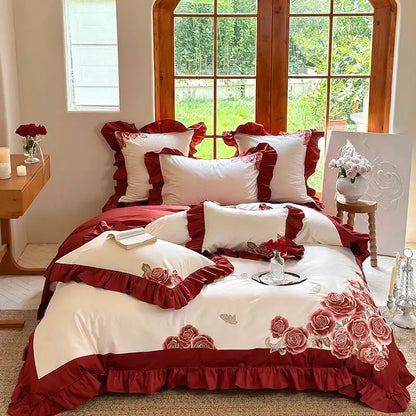 Red and white floral bedding set with ruffled edges featuring decorbites butterfly flowers embroidery on pink satin