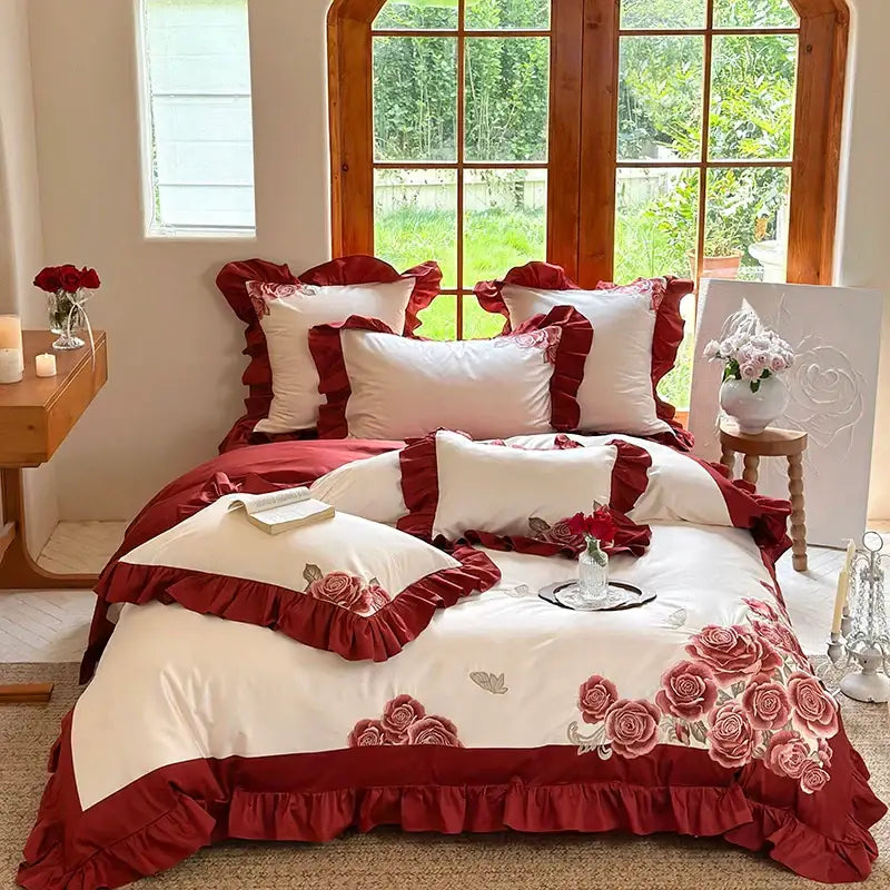 Red and white floral bedding set with ruffled edges featuring decorbites butterfly flowers embroidery on pink satin