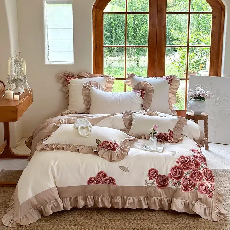 Cream-colored satin bedding set with butterfly flowers embroidery pink roses and ruffled edges by decorbites