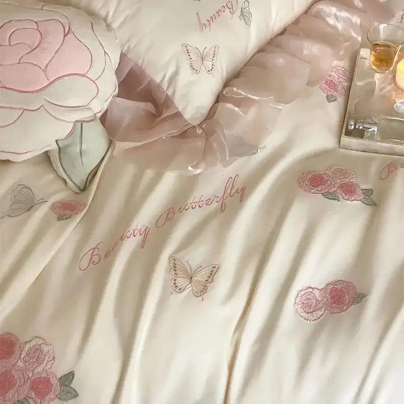 Cream-colored satin bedding set with pink and gray embroidered roses butterflies and beauty butterfly script decorbites butterfly flowers lace