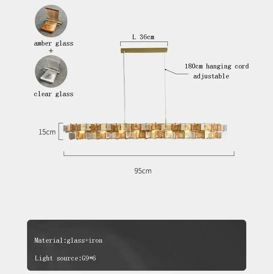 A modern decorbites butterfly glass chandelier with amber and clear glass panels in a gold rectangular iron frame for dining room