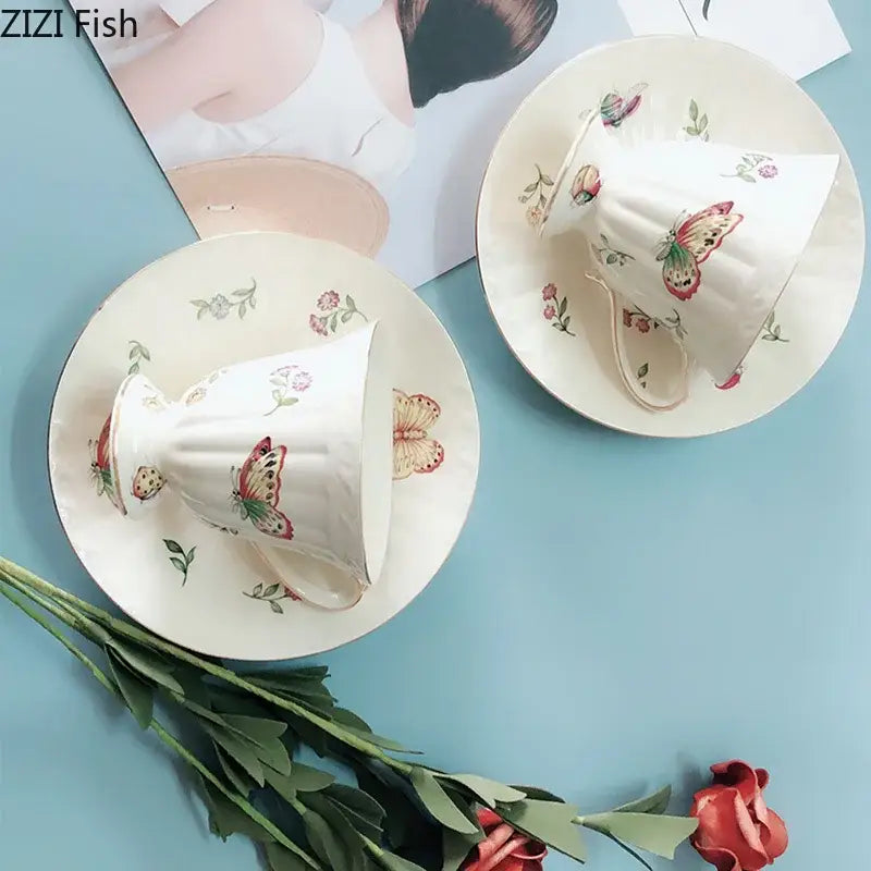 White butterfly gold ceramic cup and saucer set featuring delicate butterfly and floral patterns for dining room use