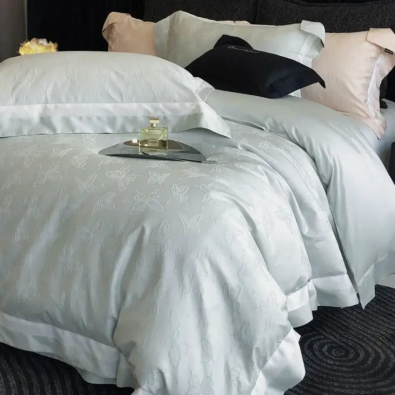 Light blue satin duvet cover with delicate white butterfly embroidery from decorbites butterfly jacquard bedding set