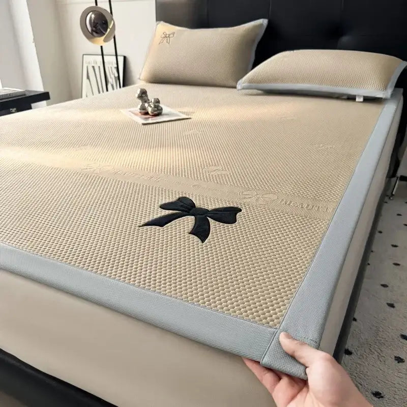 Beige mesh cooling mattress pad with black embroidered bow and gray border for decorbites butterfly knot jacquard cool mat set