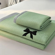 Light green cool mat bedroom cushion set with textured towel featuring black embroidered butterfly knot jacquard trim
