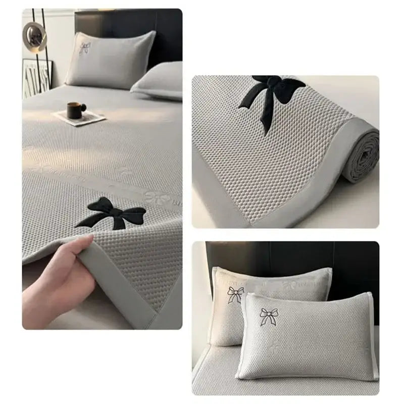 Gray textured cooling mattress pad with black bow accents in decorbites butterfly knot jacquard cool mat set
