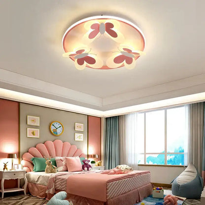 Round ceiling light with three pink and white butterfly designs emitting warm glow decorbites butterfly pink ceiling light