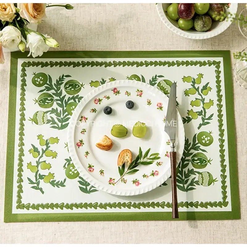 White ceramic plate with green pomegranate floral patterns and scalloped edge complementing decorbites butterfly print decorbites butterfly print pillow