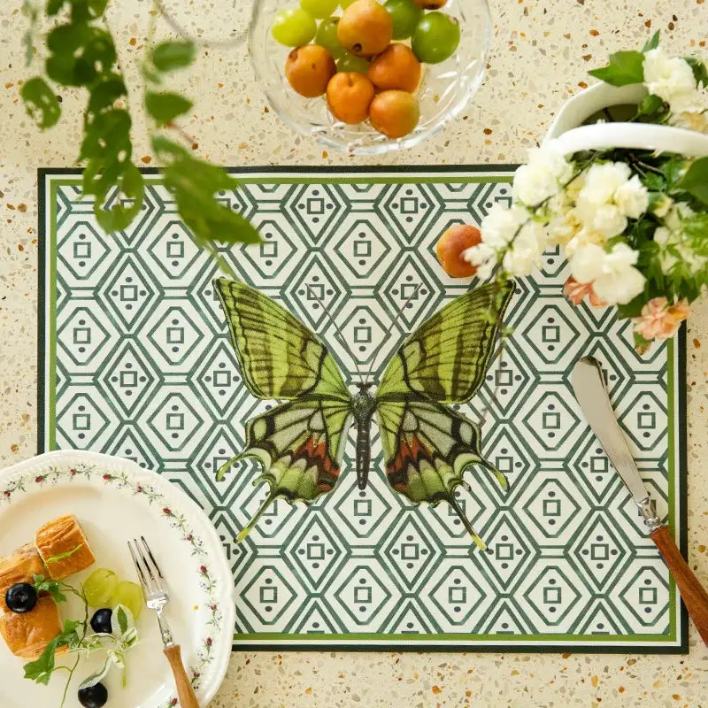 Green and off-white butterfly print placemat featuring a detailed green butterfly with red accents for decorbites butterfly print decor
