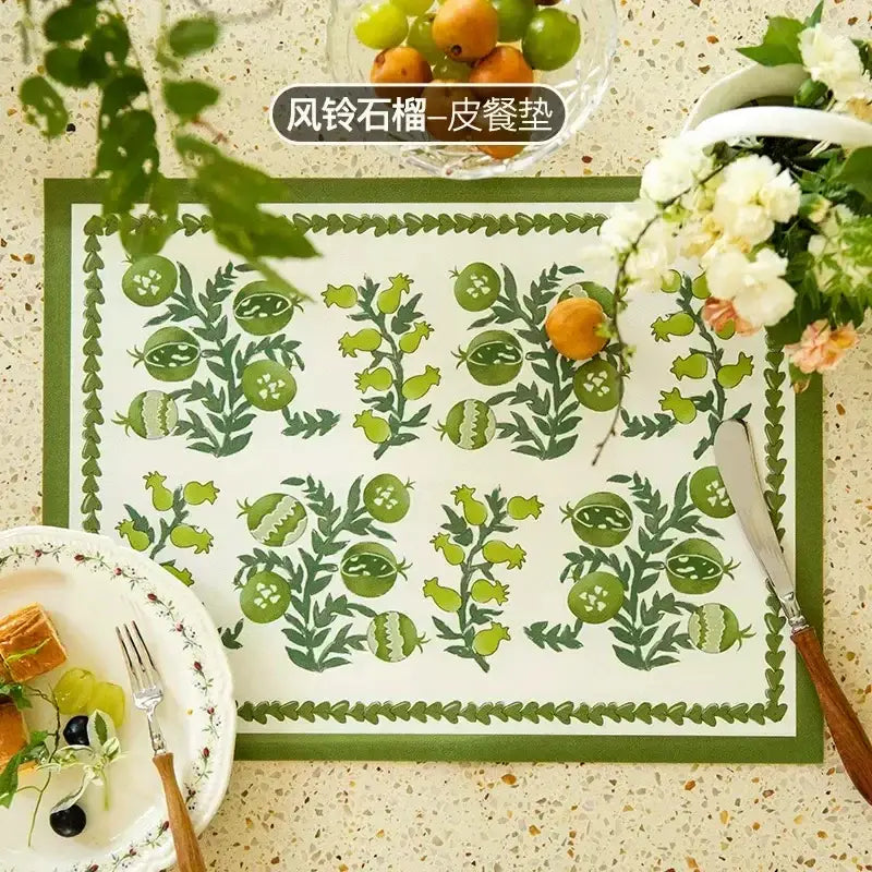 Green and white butterfly print placemat with botanical pomegranate design and olive-green leafy border for decorbites decorbites butterfly print