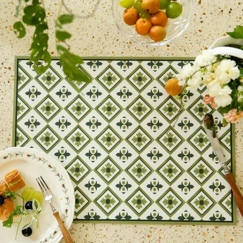 Green and white geometric-patterned placemat with vintage tile design complementing decorbites butterfly print decor