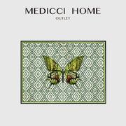Medici home outlet butterfly print throw pillow featuring a green and black butterfly on an off-white geometric decorbites butterfly print background
