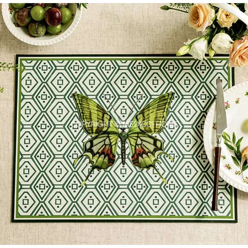 Green and white geometric butterfly print placemat featuring a detailed green butterfly with red accents for decorbites decor