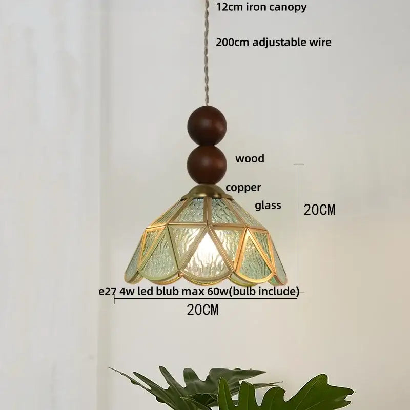 A 20cm tall decorbites butterfly tiffany glass pendant light with textured green panels copper frame and wood accents