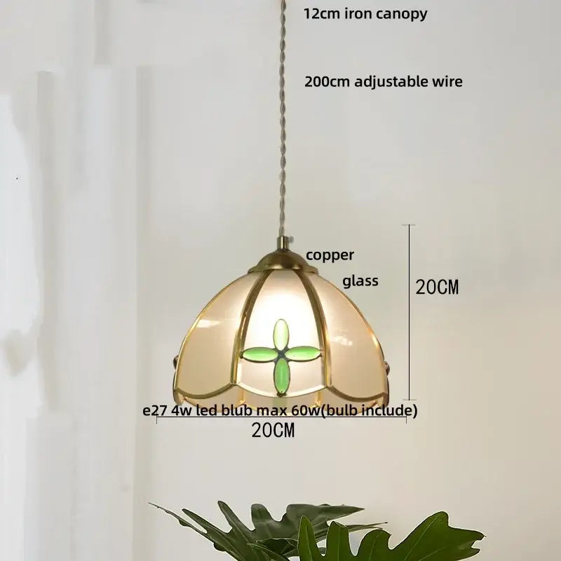 Delicate copper-framed decorbites butterfly tiffany glass pendant light with cream shade and green quatrefoil design