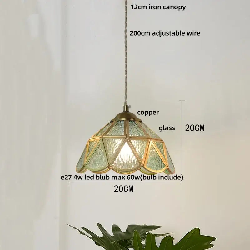 A 20cm tall decorbites butterfly tiffany glass pendant light with a copper frame and blue green textured panels for dining room decor
