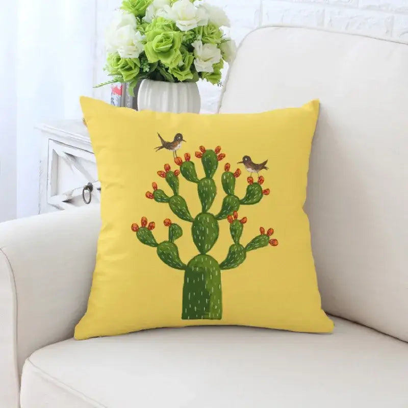 Bright yellow decorative pillowcase with decorbites cactus hand painting featuring green cactus and two brown birds