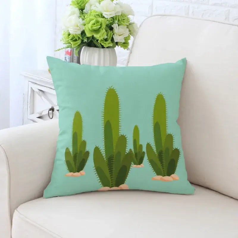 A mint green decorative pillowcase with decorbites cactus hand painting featuring cacti and beige rocks for living room sofa