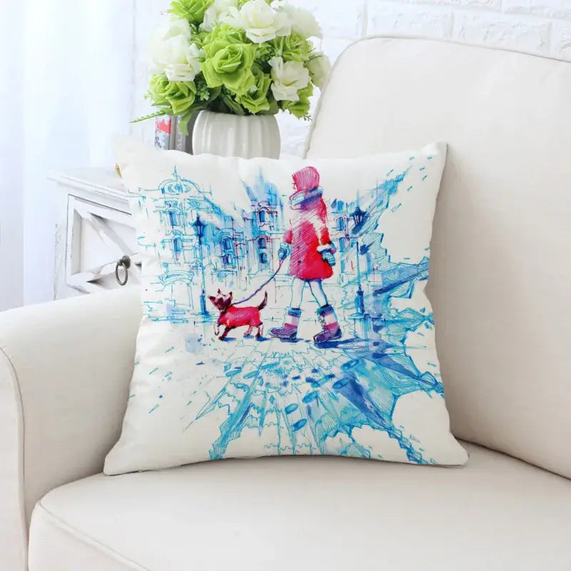 White decorative pillowcase featuring cactus hand painting with a child in red winter attire and dog in blue cityscape