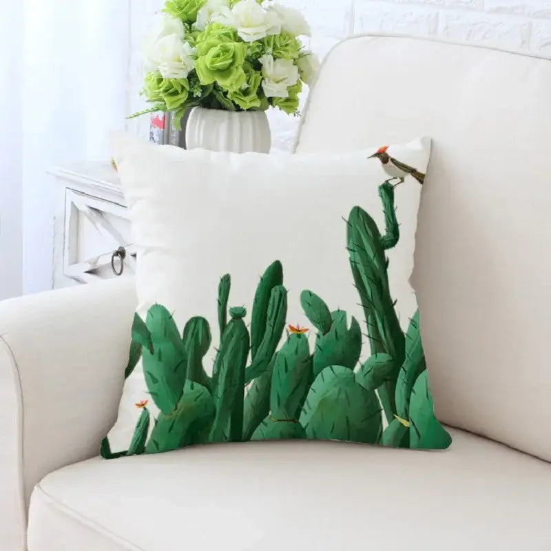 White decorative pillowcase with decorbites cactus hand painting featuring green cactus orange flowers and bird for living room