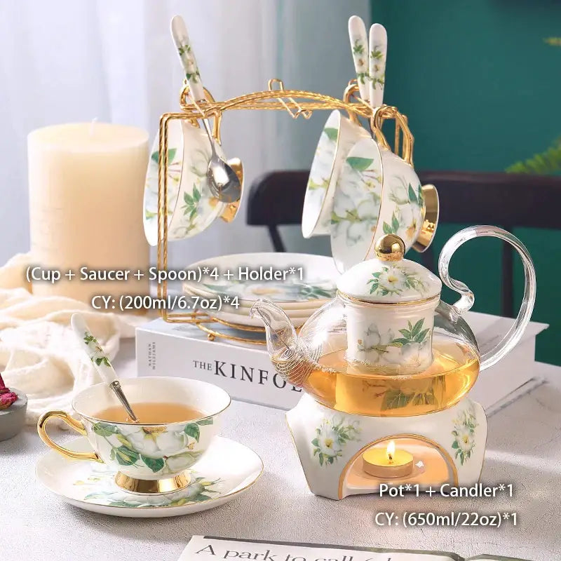 Glass teapot with camellia floral pattern and gold trim on white ceramic warmer from decorbites camellia floral tea set