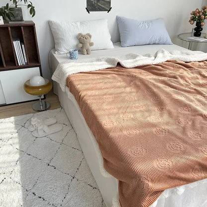 Coralb coral colored textured throw blanket with raised floral patterns and soft white fleece border from decorbites camellia jacquard lamb collection