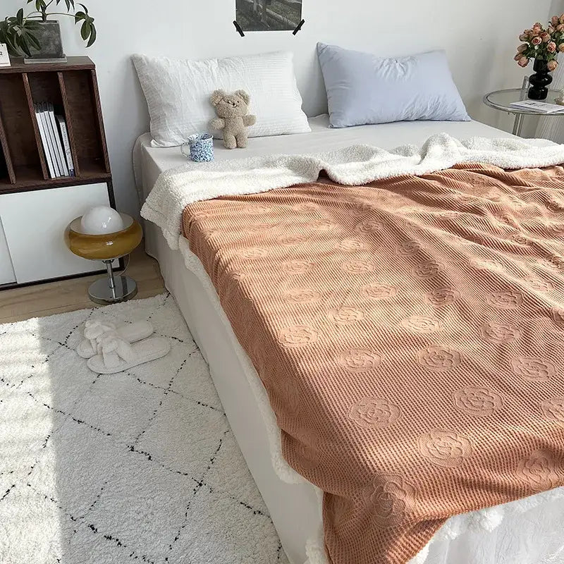 Coralb coral colored textured throw blanket with raised floral patterns and soft white fleece border from decorbites camellia jacquard lamb collection