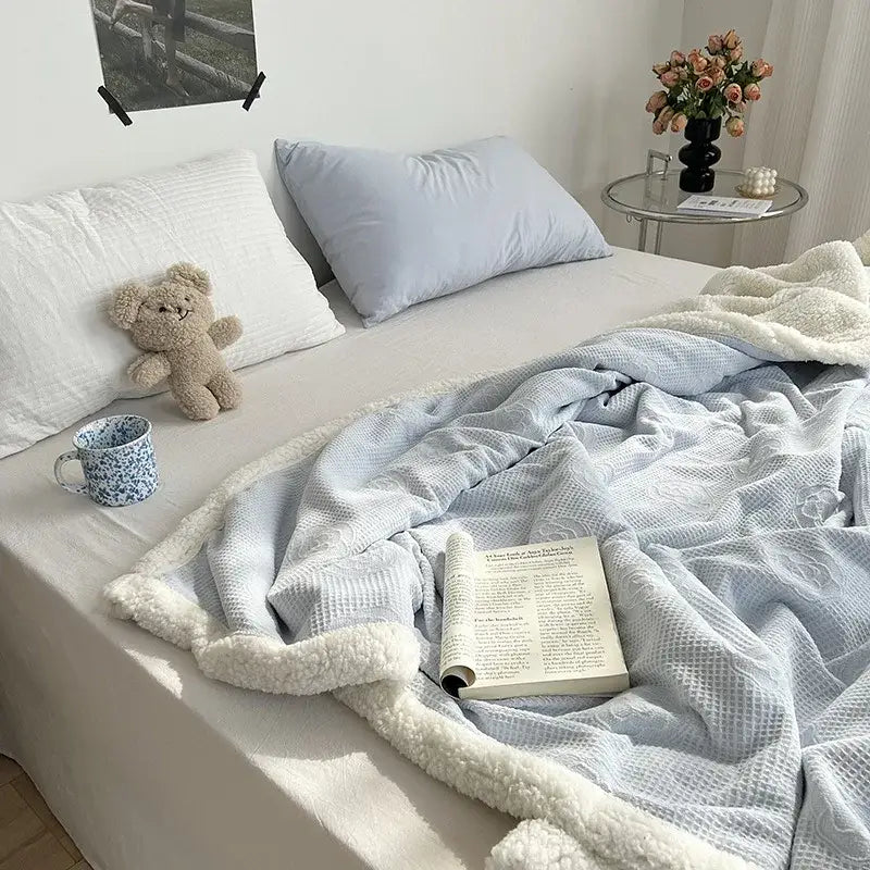 Light blue waffle-knit decorbites camellia jacquard lamb wool blanket with plush white fleece border for cozy bedrooms