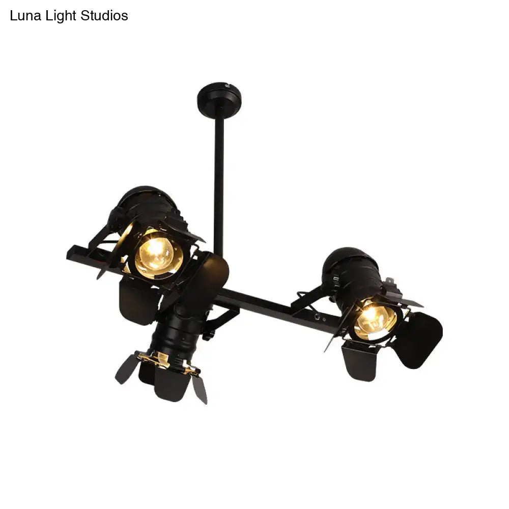 Black industrial-style art deco black finish chandelier with two vintage spotlight fixtures and metallic island lighting