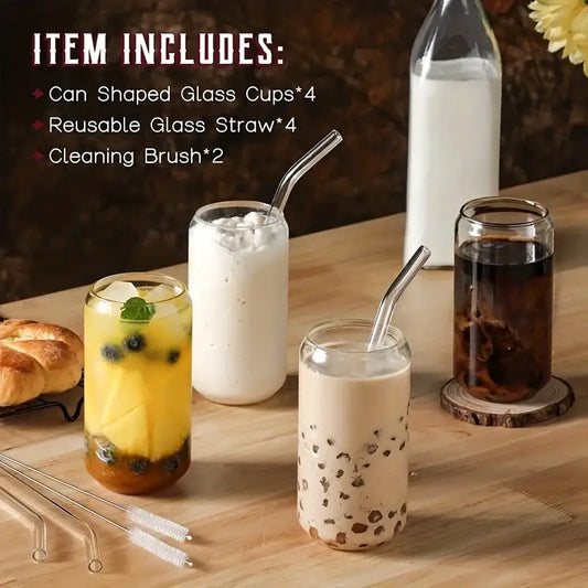 Clear glass drinking glasses set shaped like cans filled with various beverages topped with ice and tapioca pearls