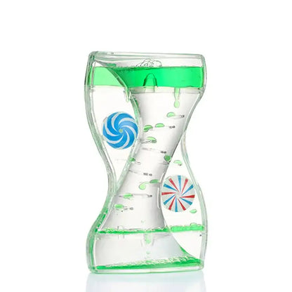 Clear glass hourglass liquid motion sand timer with green viscous fluid and colorful spiral spheres for living room decor