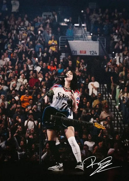 A signed canvas art print of singer b billies performing in a white and blue jersey for home decor
