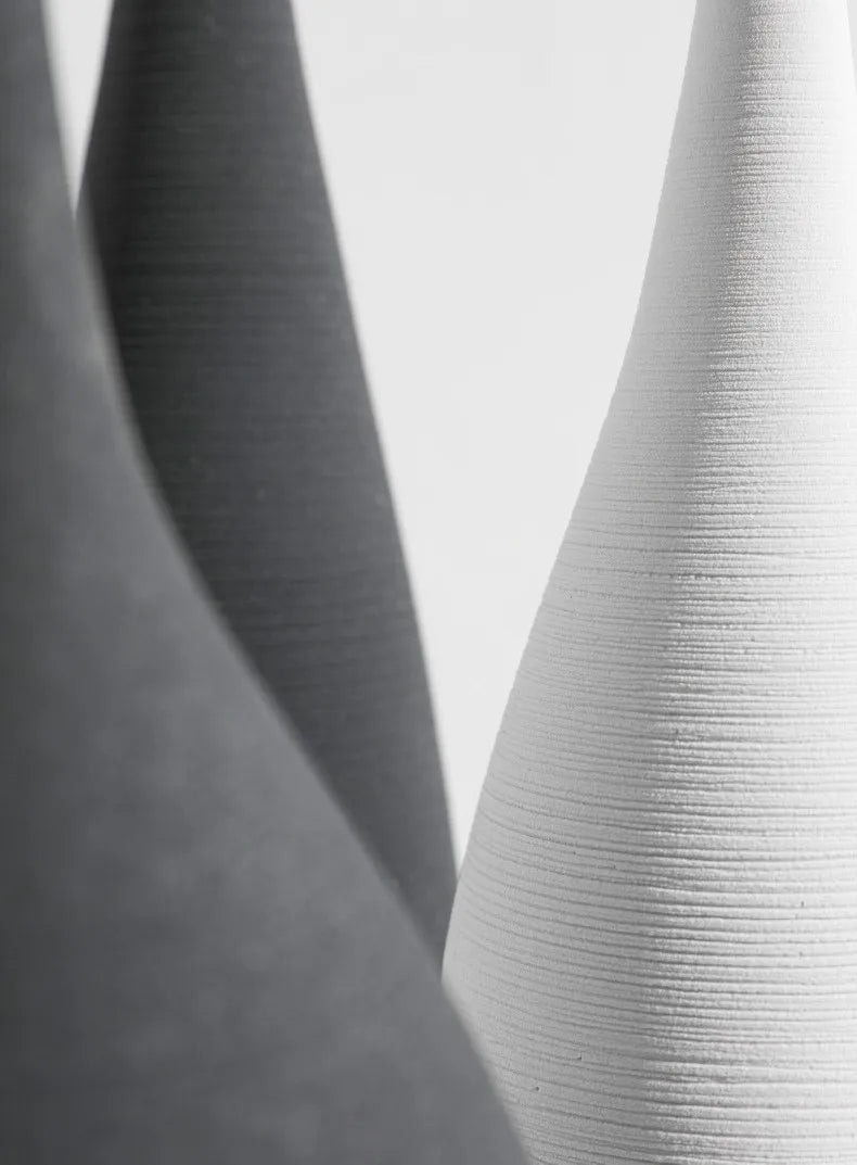 White ceramic capiron zen vase with vertical ribbed texture for nordic interior and living room decoration
