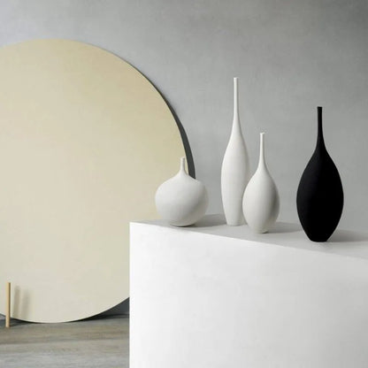 Set of minimalist white and black CAPIRON zen ceramic vases with sleek elongated forms for home decoration