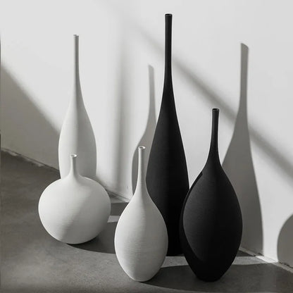 Capiron zen ceramic vases in minimalist white and matte black with elongated necks for nordic home decoration