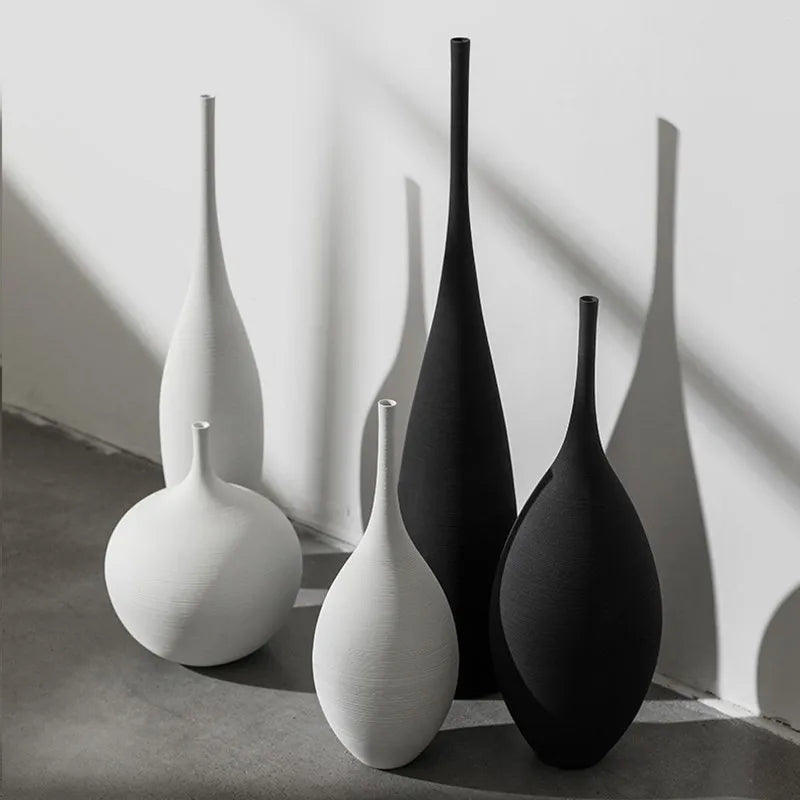 Capiron zen ceramic vases in minimalist white and matte black with elongated necks for nordic home decoration