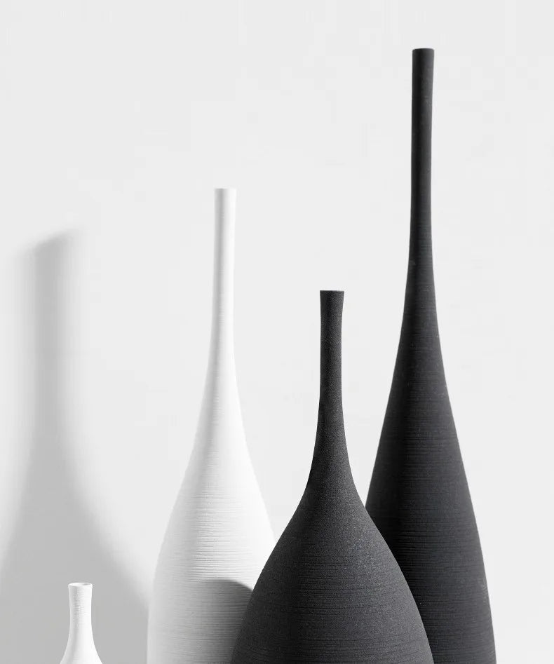 Minimalist CAPIRON zen ceramic vases in white and matte black with elongated necks for Nordic home decoration